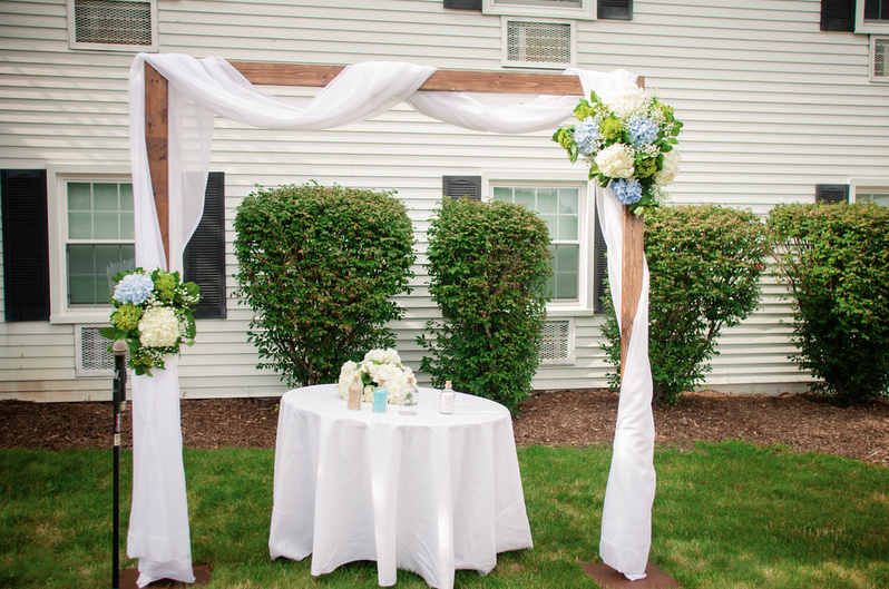 Wooden Ceremony Arch. Includes fabric, delivery, set-up, tear-down. $100 with any planning package. $220 on it's own.&nbsp;